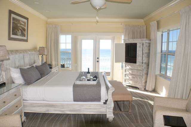 Front corner King bed suite with balcony overlooking the beach