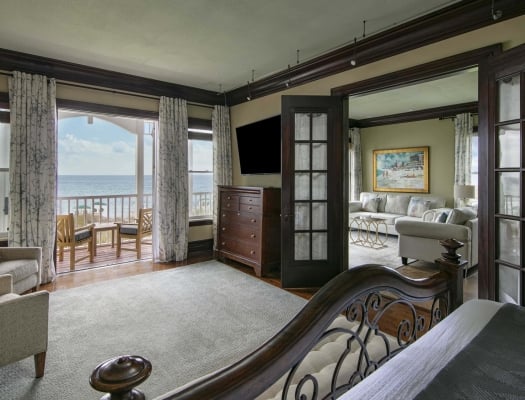 A luxurious presidential suite with balcony and ocean views