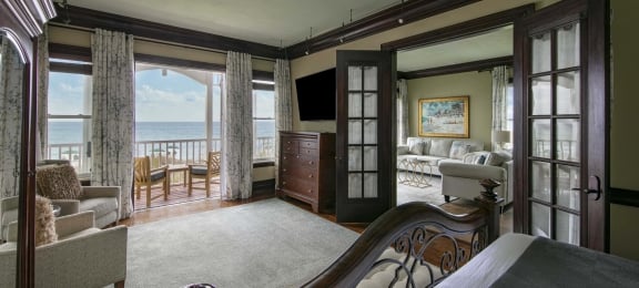 A luxurious presidential suite with balcony and ocean views