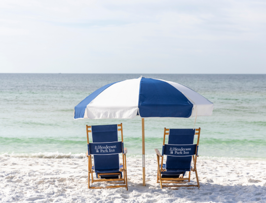 2 beach chairs umbrella centered