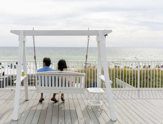 Couple on swing back view