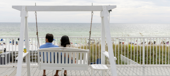 Couple on swing back view