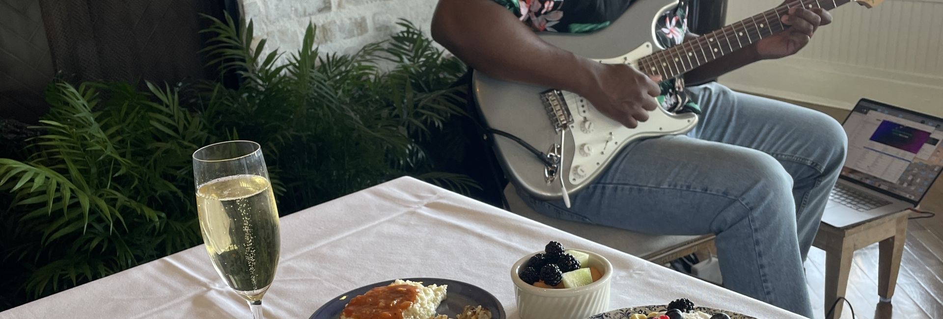 Live music act plays guitar during brunch