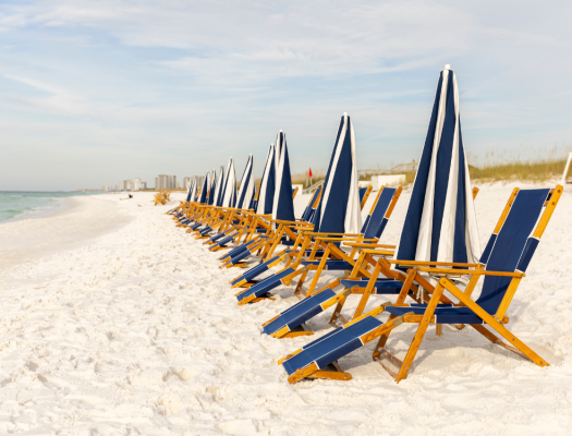 Row of chairs setup on beach